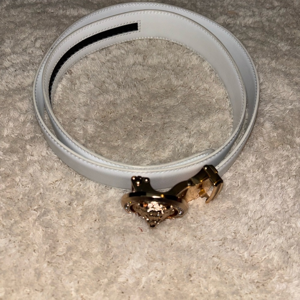 White Leather Belt with Gold wolf head buckle.